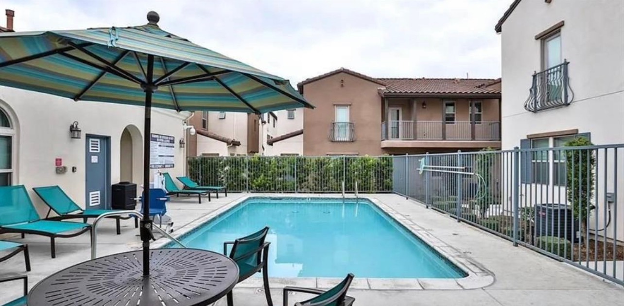 Community pool with lounge seating