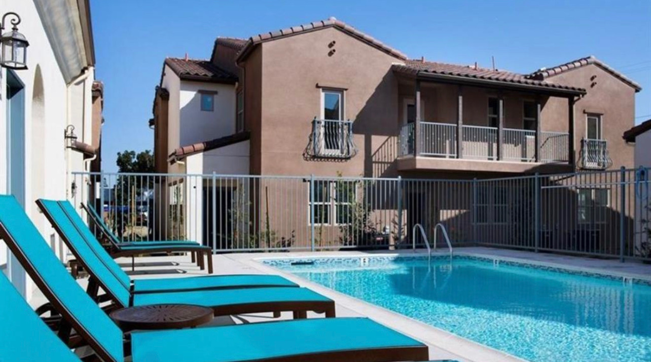 Community pool and townhome exterior